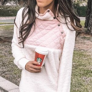 Pink and white snap fleece